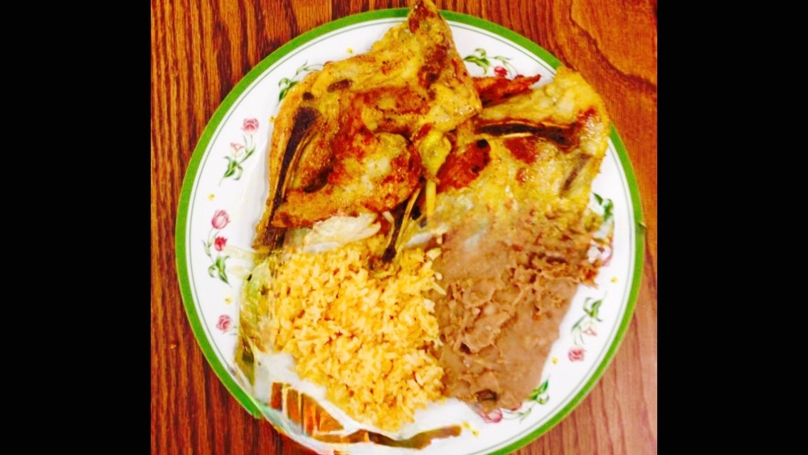 Pollo asado plate with Mexican rice and refried beans at Jake's Meats