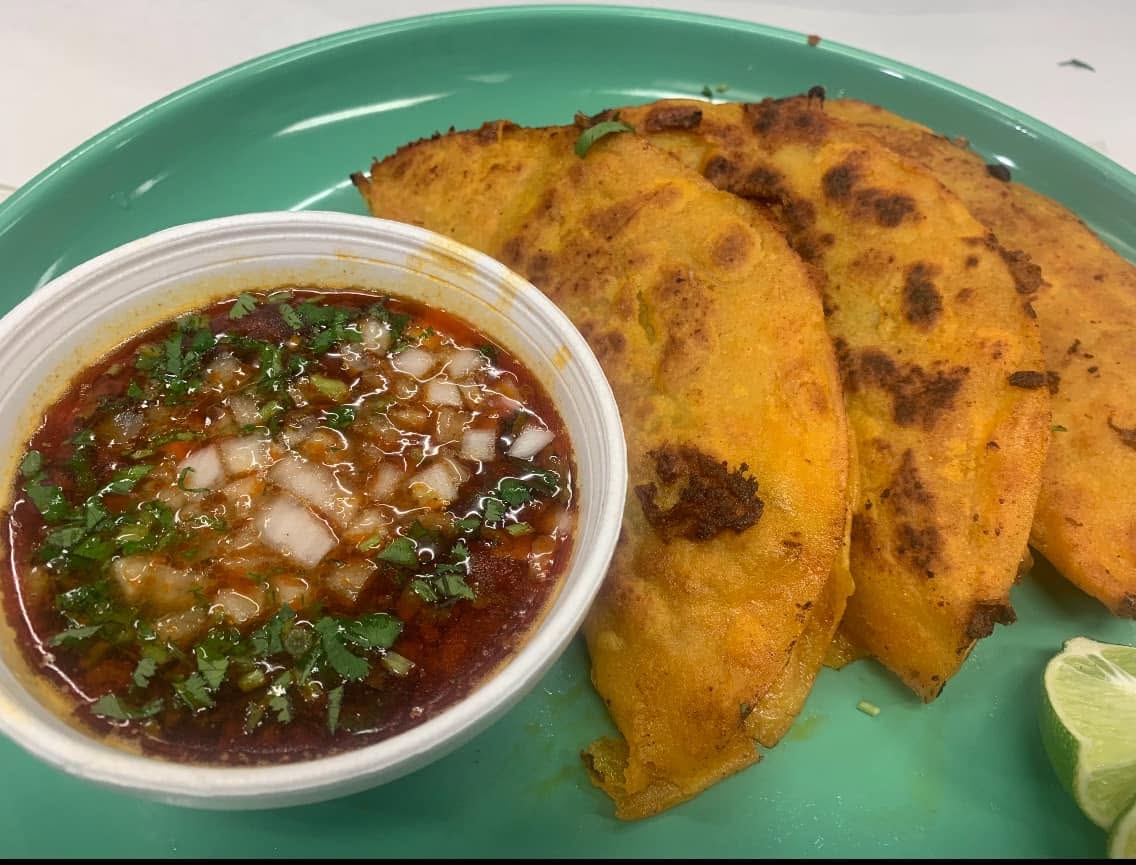 Quesabirria tacos with consomé dipping broth at Jake's Meats
