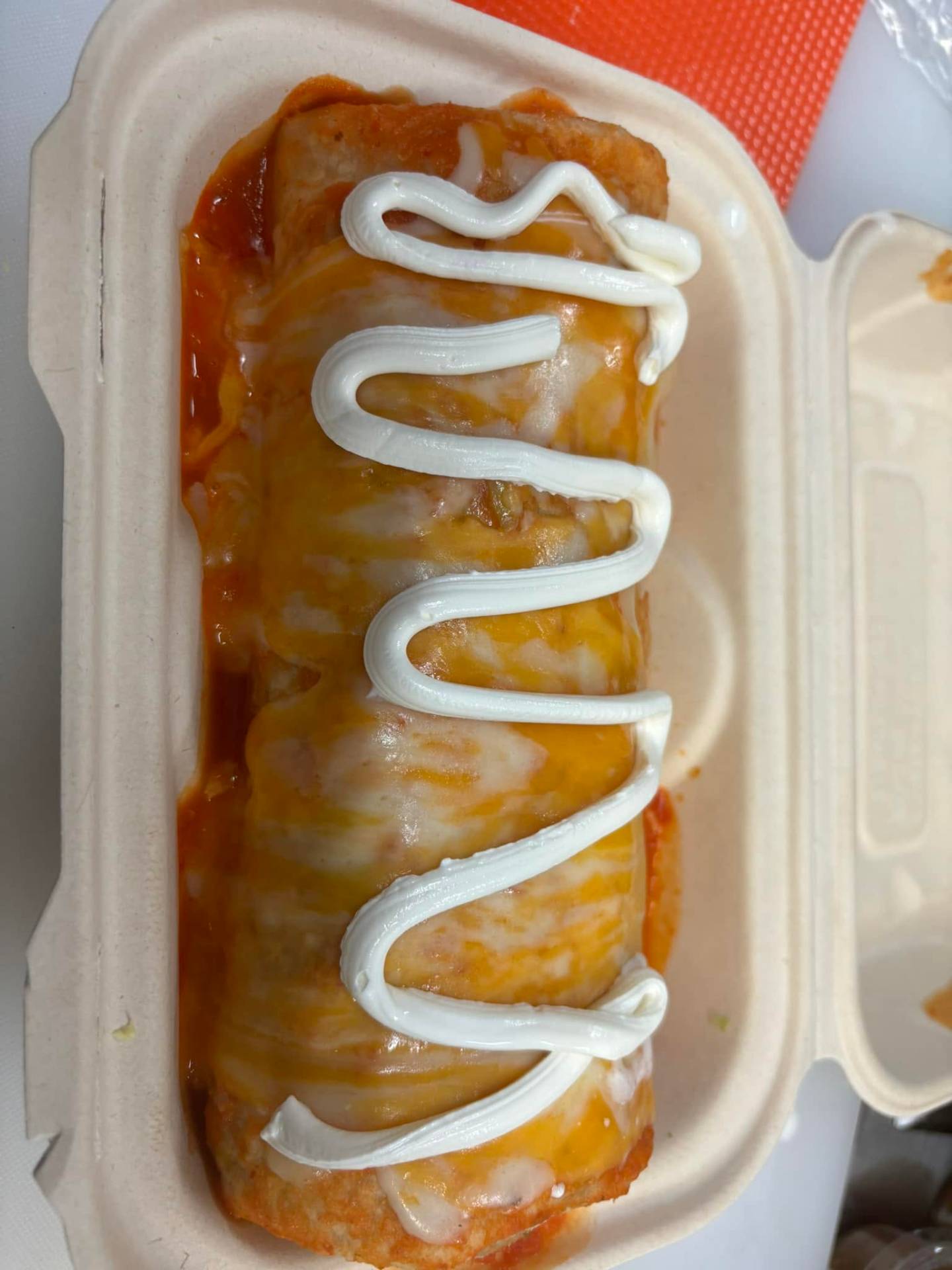 Mojado burrito smothered in red sauce and cheese