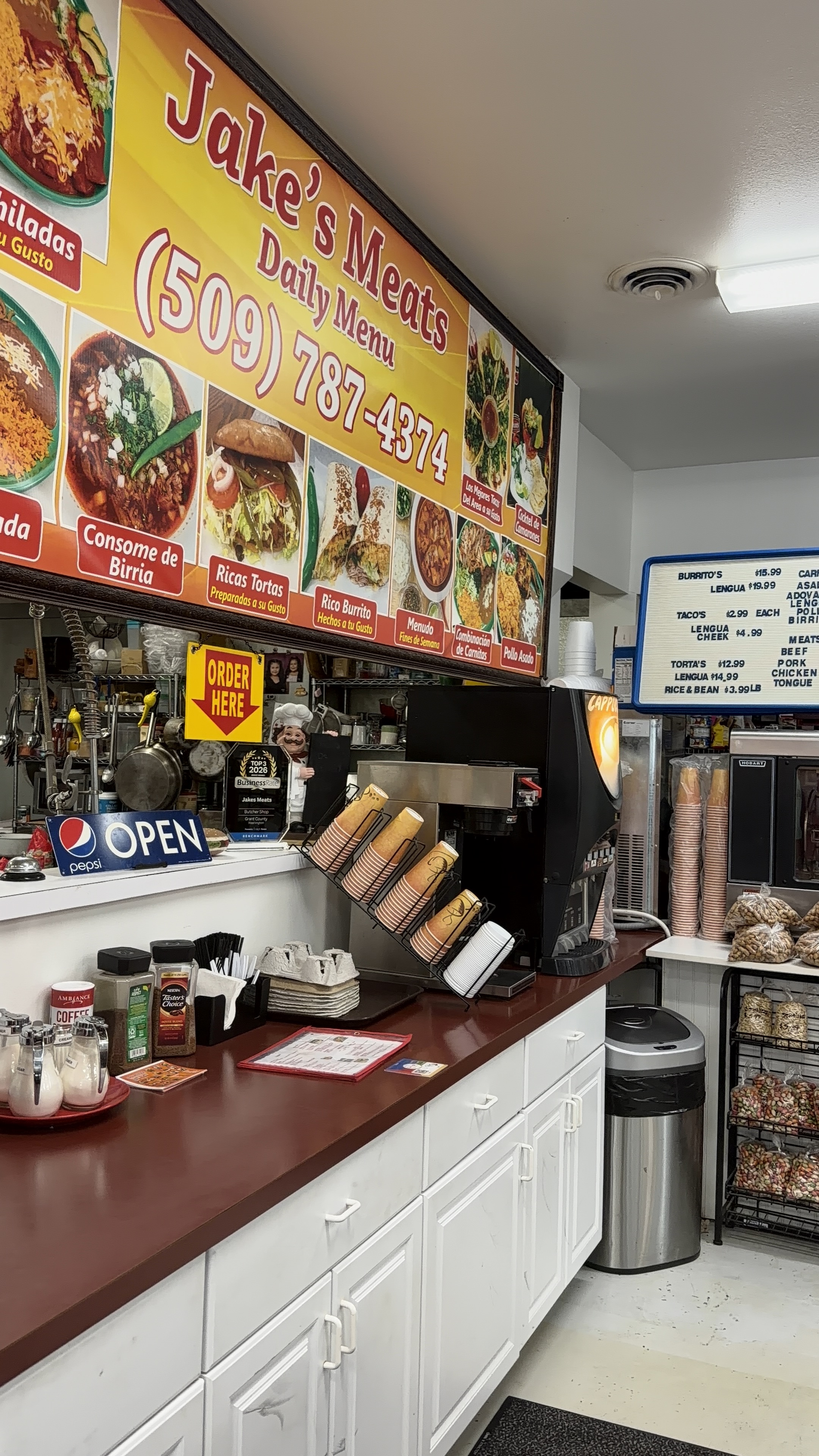 Front counter with coffee, cappuccino and the Jake's Meats daily menu